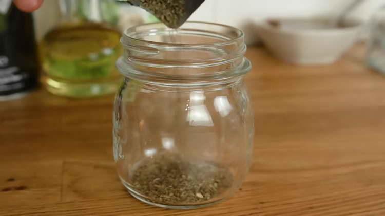 pour spices into jars