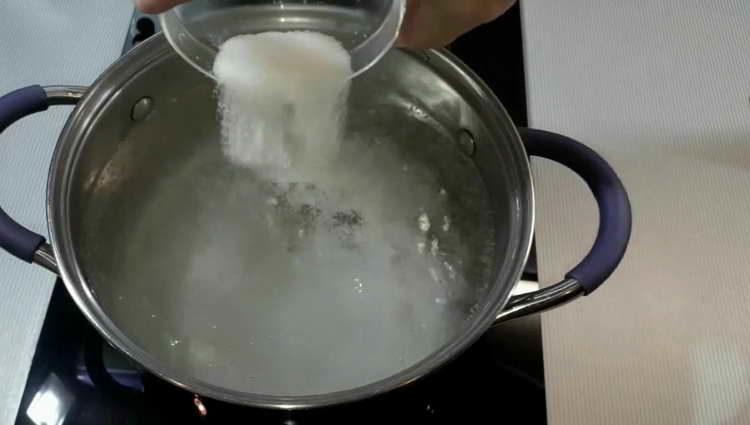 pour sugar into boiling water
