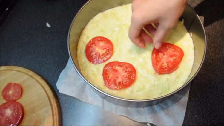 put the tomatoes on the dough