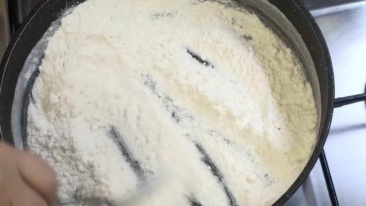 pour flour into the pan