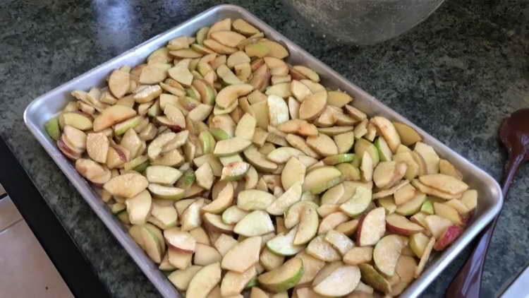 pour apples on a baking sheet