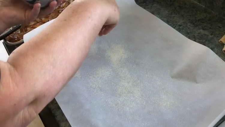 pour sugar on parchment paper