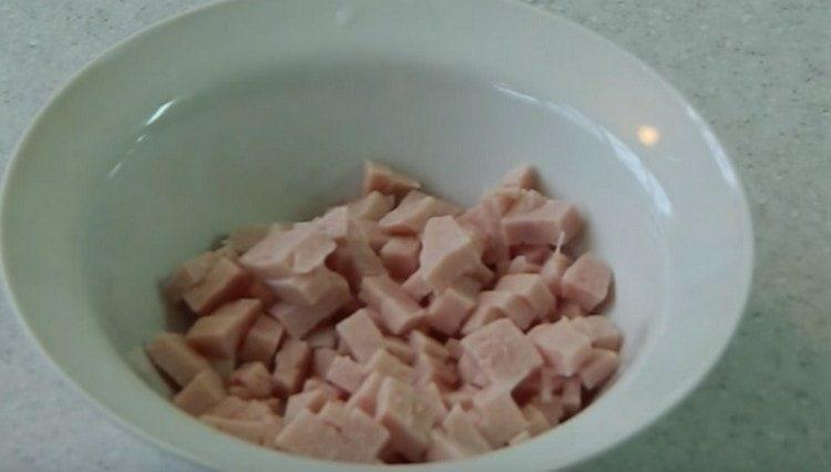 First, cut the sausage into a small cube.