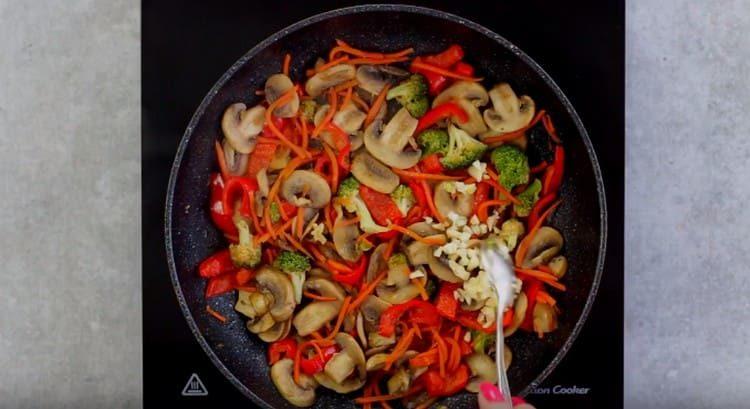 Season mushrooms with vegetables and garlic.