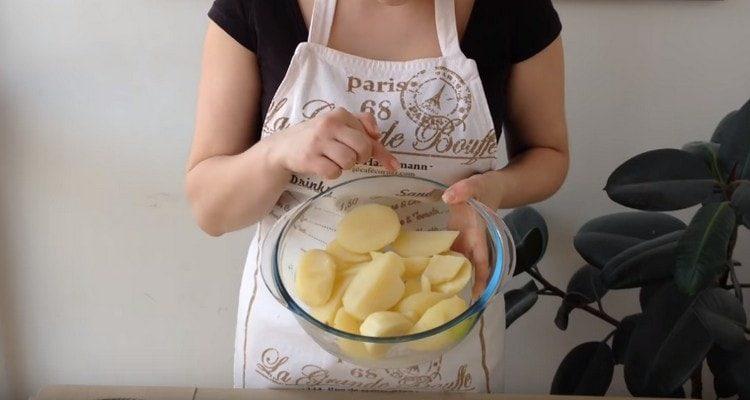 Boil the potatoes until cooked.