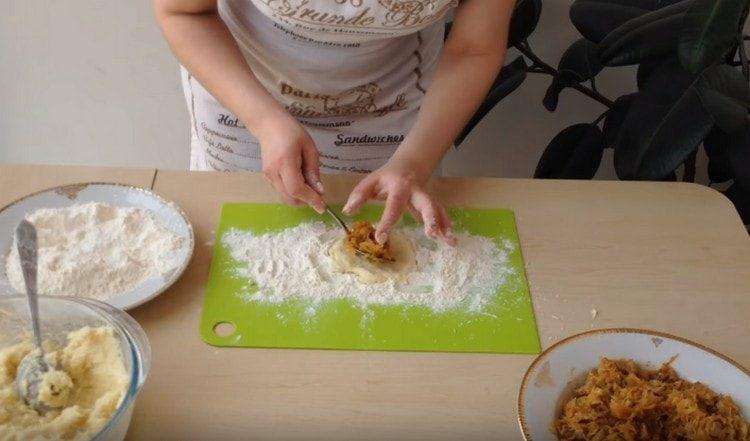 We spread cabbage filling on the center of the tortilla.