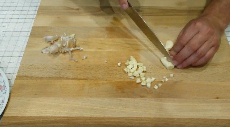 Grind a few cloves of garlic.