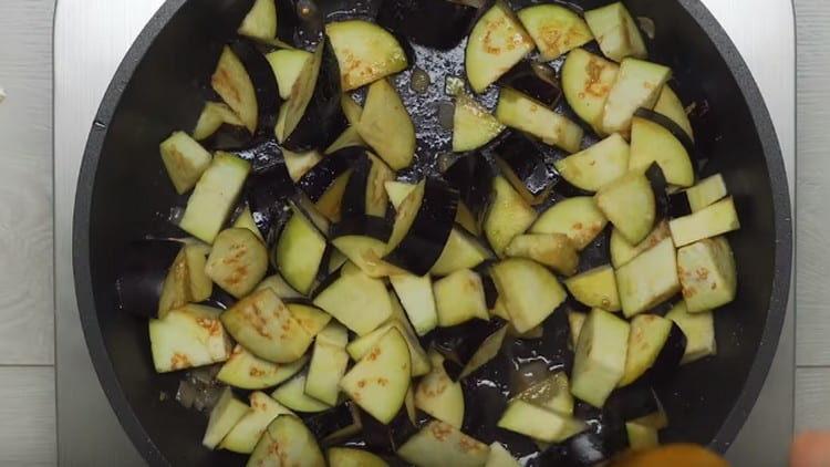 Fry eggplant in a pan, removing meat from there.