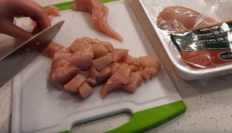 cut the chicken into pieces.