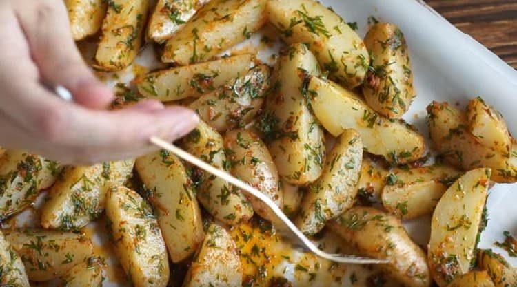 Put the potatoes on a baking sheet and put in the oven.