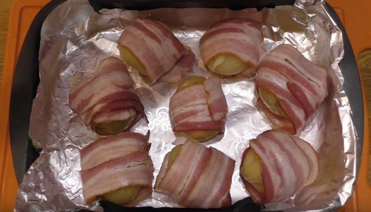 Put the potatoes on a baking sheet and bake in the oven.