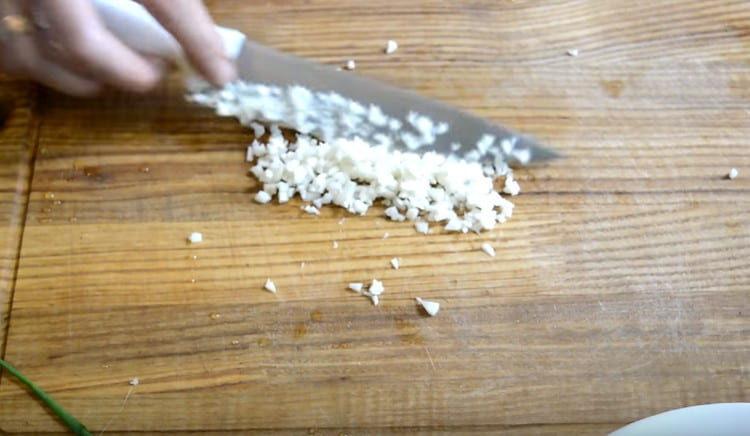Finely chop the garlic.