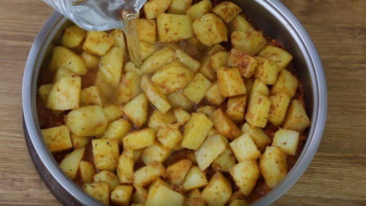 Add water and stew potatoes.