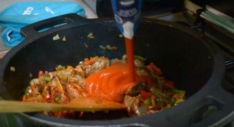 Add tomato sauce to the cauldron.