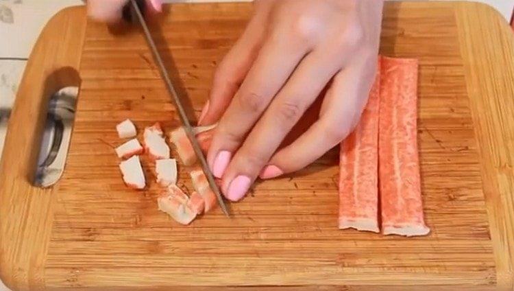 Cut the crab sticks into a small dice.