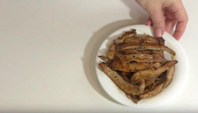 Chicken fillet cut into strips and fry.