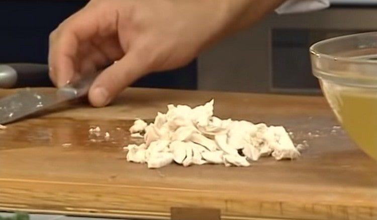 Chicken meat is cut into small pieces.