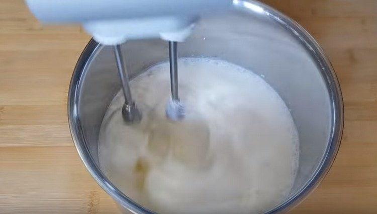 Whip the cream with a mixer.