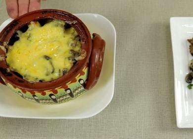 Baked potatoes in pots  with meat and mushrooms