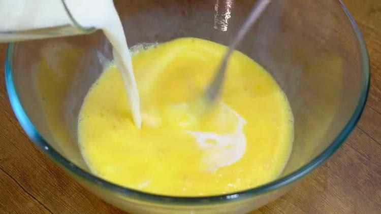 pour milk into eggs
