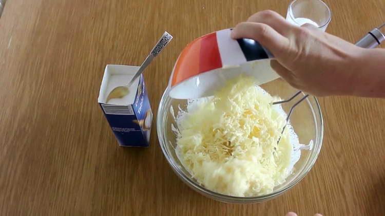 pour cheese into mashed potatoes
