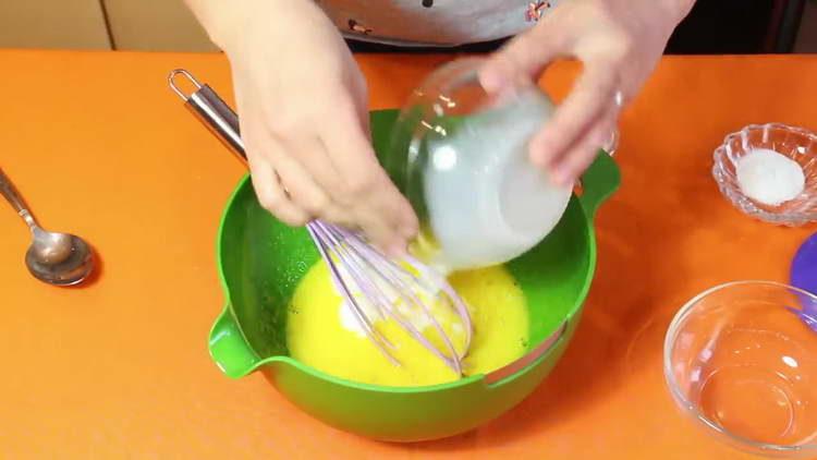 pour milk into eggs