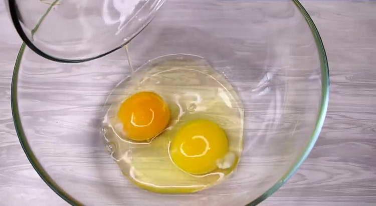 drive two eggs into a bowl