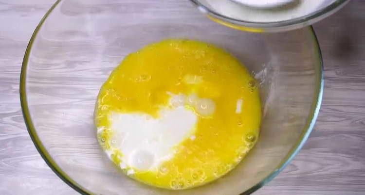 pour milk into eggs