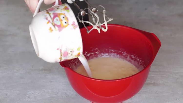 pour milk into eggs